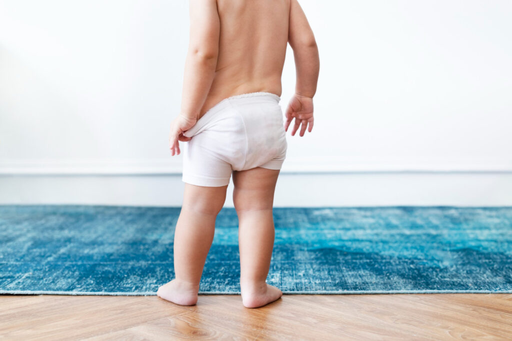 baby boy pulling his diapers baby boy pulling his diapers